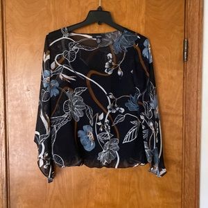 Women’s floral patterned top. And size petite medium